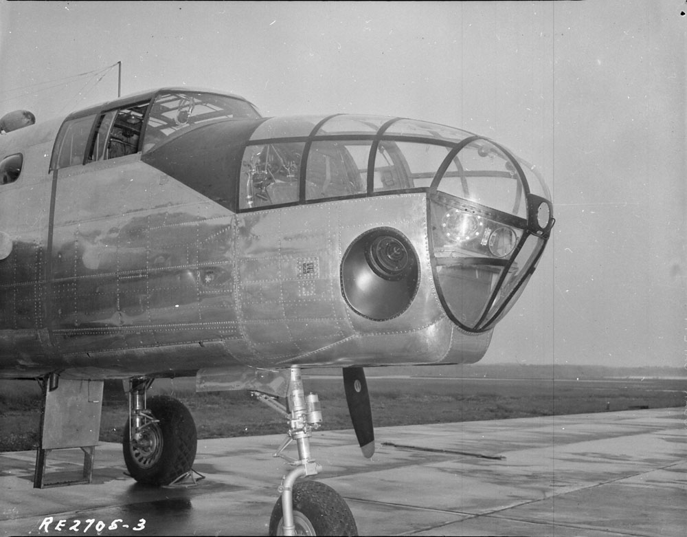 Trimetrogon camera installation in North American "Mitchell" II aircraft of No. 14 Photo Squadron, Royal Canadian Air Force seen in 1945. One of the oblique angle cameras can be seen on the side of the aircraft toward the nose. Library and Archives Canada / PA-065503, Public Domain.