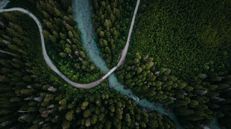 Aerial photo of forest, road, and river near Kitimat, BC [@den_engelsen_photo_2020]. [Unsplash License.](https://unsplash.com/license)